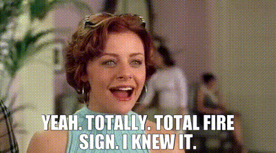 a woman is laughing and saying `` yeah , totally , total fire sign , i knew it . ``