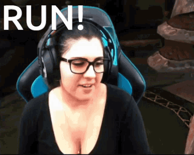 a woman wearing headphones and a black shirt with the word run behind her