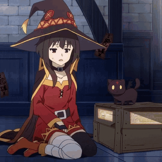 a girl in a witch hat is sitting on the floor next to a cat