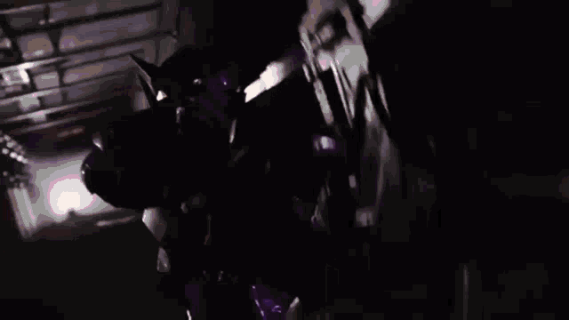 a purple light is shining on a purple background