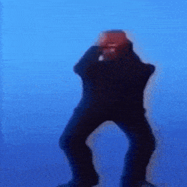 a blurry picture of a man dancing in front of a blue background