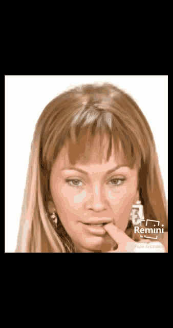 a woman 's face is being altered with remini