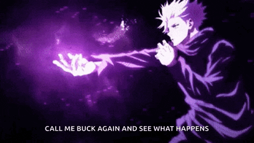 a man is holding a purple object in his hand in a dark room .