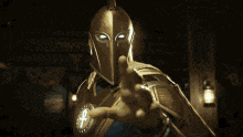 a knight with a cross on his head is holding a book in his hands .