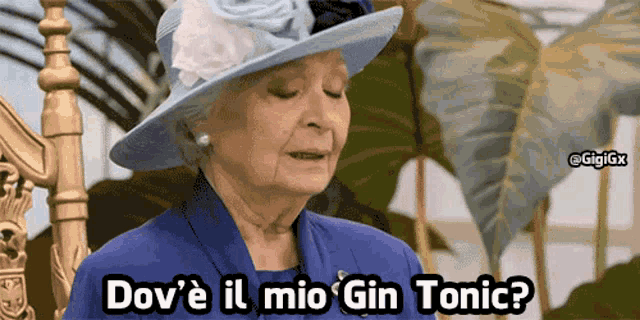 an older woman wearing a blue dress and a blue hat says dov 'e il mio gin tonic