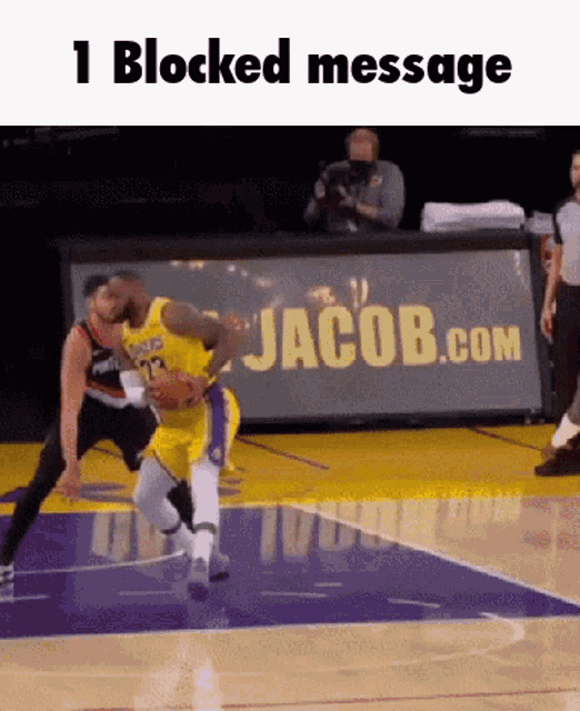a basketball game is being played on a court with a jacob.com banner in the background