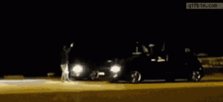 a blurry picture of a person jumping in the air at night