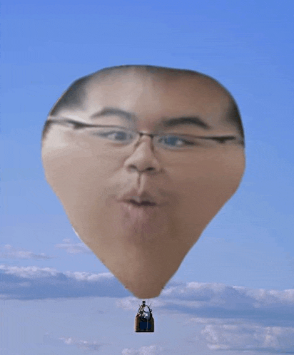 a hot air balloon with a man 's face in it