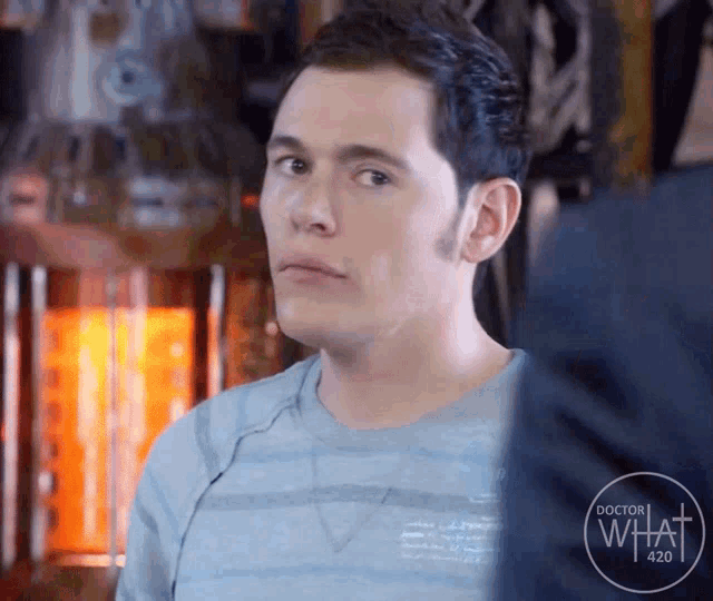 a man is wearing a blue shirt that says doctor who 420