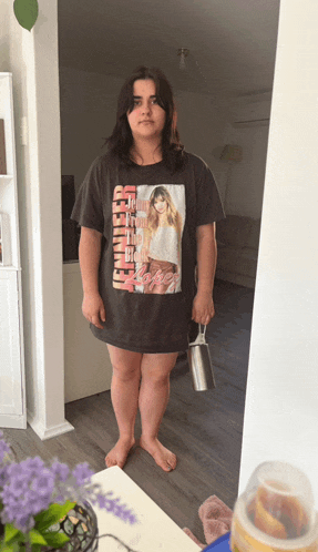 a woman wearing a jennifer lopez t-shirt