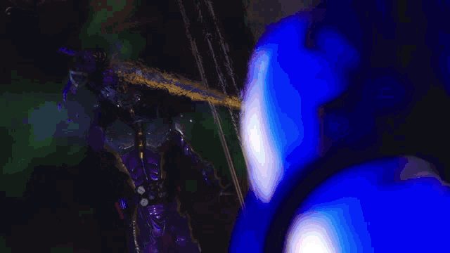 a purple and blue background with a few white spots
