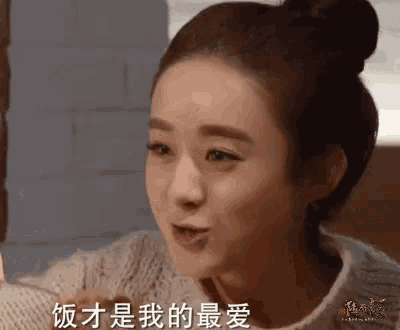 a woman with chinese writing on her face is eating