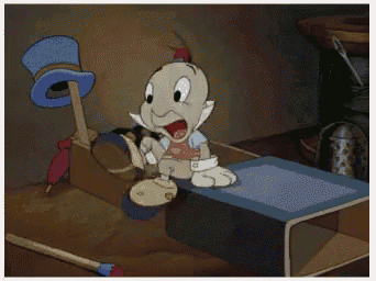 a cartoon character with a magnifying glass is sitting on a table