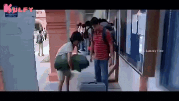 a group of people standing in a hallway with the word kulfy on the bottom