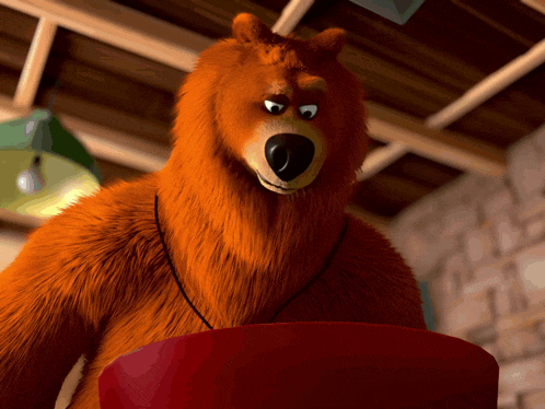 a cartoon bear with a red bucket in front of him