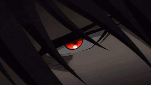 a close up of a person 's red eye with black hair