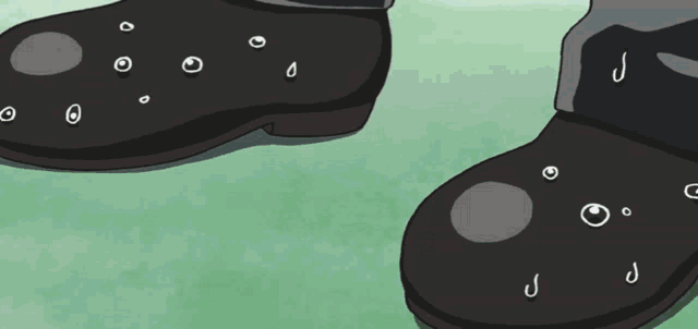 a pair of black shoes with holes in them