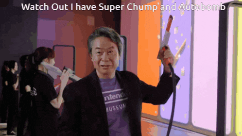 a man wearing a purple shirt that says nintendo museum is holding a gun