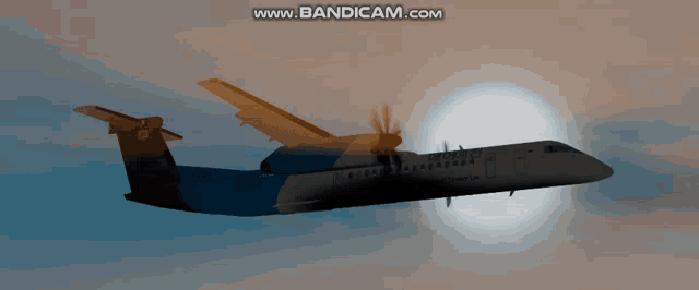 an airplane is flying in the sky and the website www.bandicam.com is visible