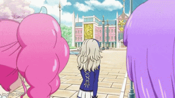 three anime girls are standing in front of a large building