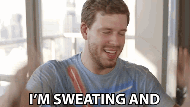 a man says i 'm sweating and with his hands up