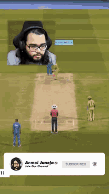 a man playing a video game with an ad for anmol juneja