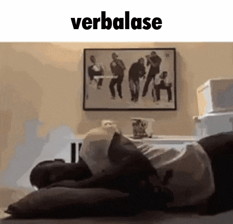 a man is laying on a bed with a picture on the wall above him that says verbalase