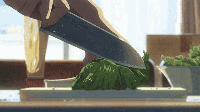 a person is cutting a piece of lettuce with a knife that says copro