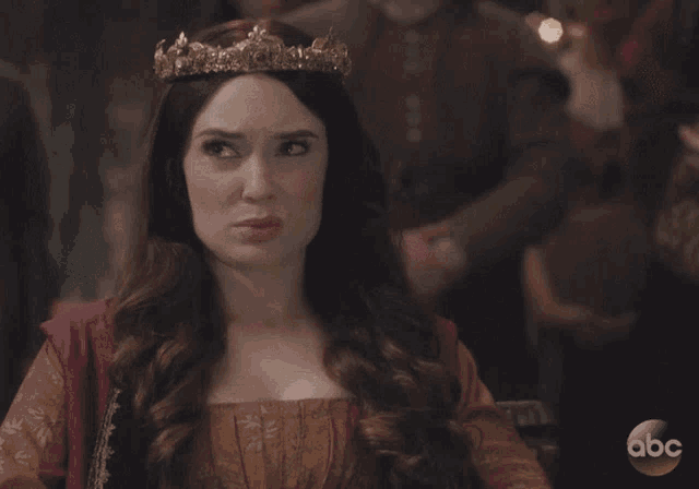 a woman with a tiara on her head says what on god 's flat earth is going on