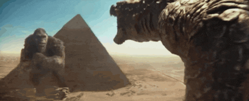 a giant gorilla and a giant lizard are standing in front of a pyramid