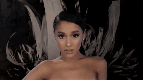 ariana grande is a naked woman in a painting .