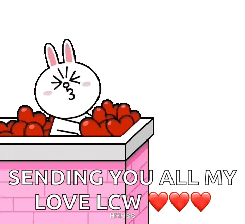 a cartoon rabbit is holding a bunch of red hearts in a box .