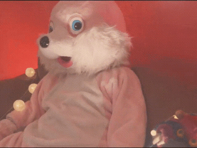 a stuffed animal in a pink and white bunny costume