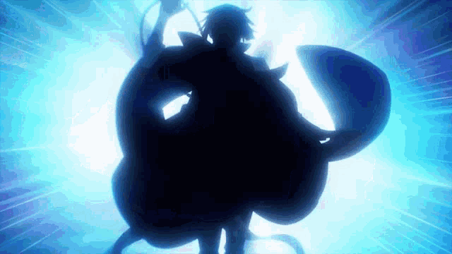 a silhouette of a person standing in the dark with a blue light behind them