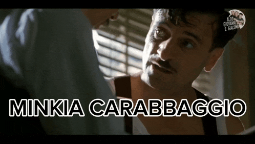 a man with a mustache is talking to another man with the words minkia carabbaggio written on the bottom