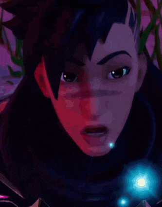 a close up of a person 's face with a surprised look on her face