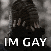 a black and white photo of a person with their hands covering their face and the words `` im gay '' .