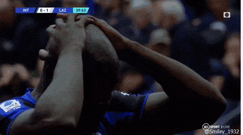 a soccer game is being played and the score is 0 - 1