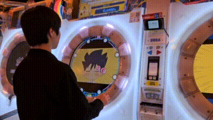 a man is playing a video game with a cartoon character on it .