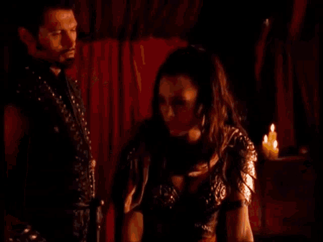 a man and a woman are standing next to each other and the woman says the exotic in yellow letters