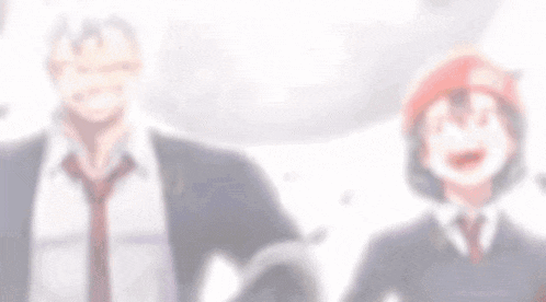 a man and a girl are standing next to each other . the girl is wearing a red hat .