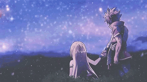 a boy and a girl are holding hands under a starry sky .