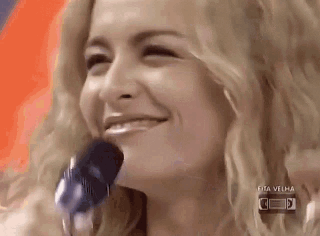 a close up of a woman 's face with rita velha written on the bottom right