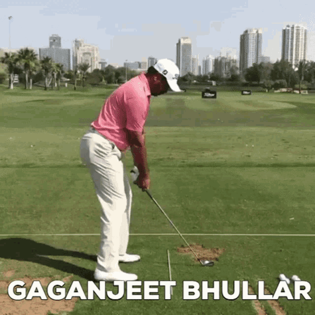a man in a pink shirt is swinging a golf club on a golf course with gaganjeet bhullar above him