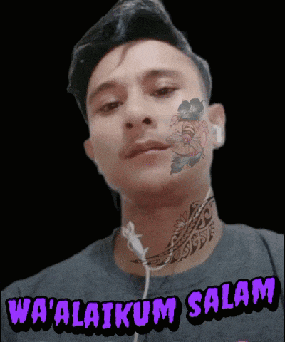 a man with a tattoo on his face and the words wa ' alaikum salam above him