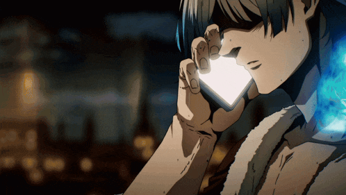 a man is talking on a cell phone with a light coming out of it