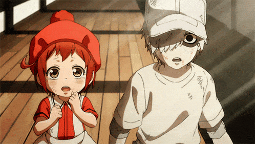 a boy and a girl standing next to each other