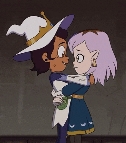 two cartoon characters are hugging each other and kissing .