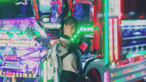 a woman in a futuristic outfit is standing in front of a neon sign that says ' a ' on it
