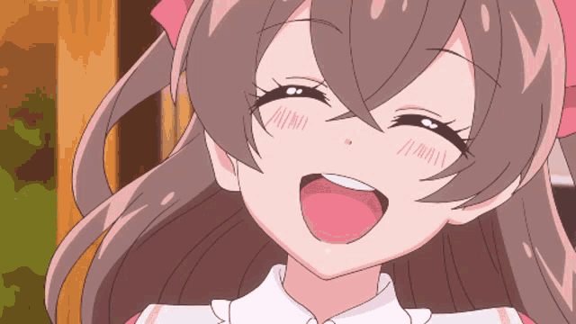 a close up of a girl 's face with a pink bow in her hair